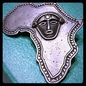 African brooch with mask